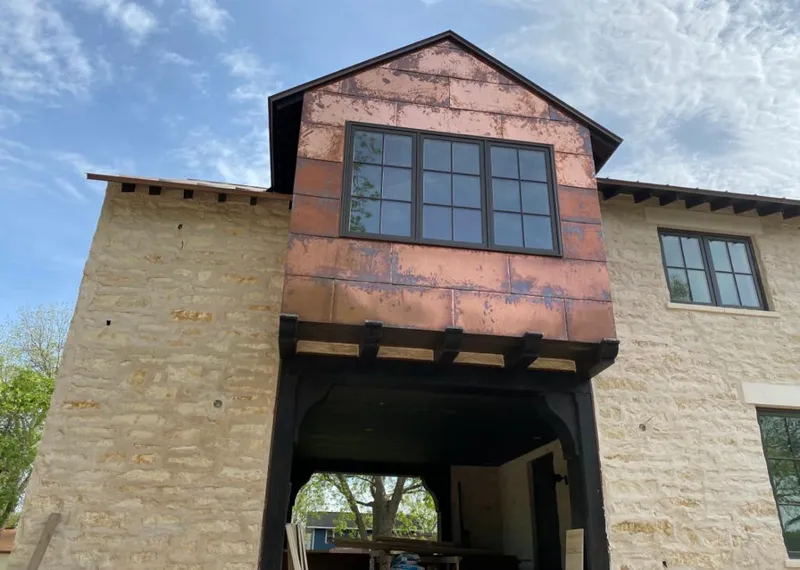 Copper metal panel facade on a stone building for Metal Roof Coating in Dixon